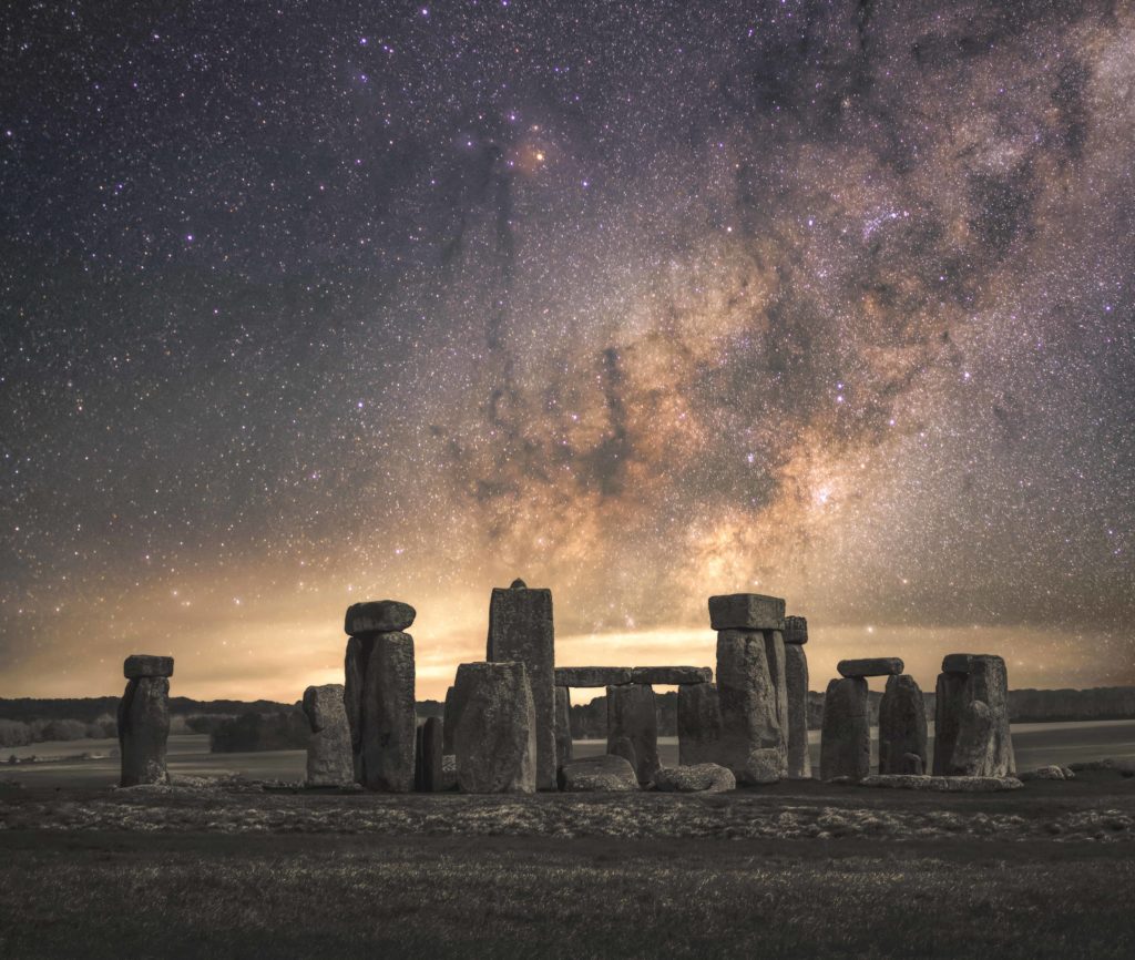 stonehenge with starry night sky overhead